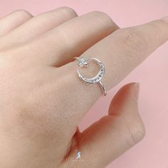 Experience the magic of the crescent moon and star with our adjustable open band ring. Made from solid 925 sterling silver and polished to perfection, it radiates beauty and shine. Add this celestial piece to your ring collection or give it as a heartfelt gift to your loved one. Materials: 925 sterling silver, cubic zirconiaAdjustable up to size US 8. Jewelry Care: See more information about how to care for your jewelry here. Shipping Policy: Orders will be shipped within 1-3 business days. Econ Latest Earrings Design, Crescent Moon And Star, Gothic Ring, Everyday Ring, Earrings Design, Gothic Rings, Moon Ring, Ring Collection, Everyday Rings