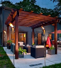 an outdoor living area is lit up at night