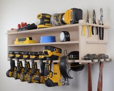 a wooden shelf filled with lots of tools