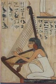 an egyptian woman playing a musical instrument