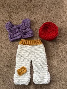 crocheted baby pants and hat laying on the floor