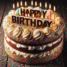 a birthday cake with lit candles and sprinkles on the top that says happy birthday