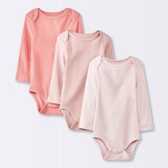 Add soft colors to your little one's closet with the 3-Pack Long-Sleeve Bodysuits from cloud island™. This pack of three pink bodysuits come in varying shades with a wide ribbed design for fun pairing with a variety of bottoms in their wardrobe. The lap shoulders and crotch snaps allow quick dressing and changing. Tailored with 100% cotton, these midweight bodysuits offer soft and breathable comfort all through their day. cloud island™: Designed with love. Made without compromise. Pink Cotton Bodysuit For Loungewear, Cute Pink Stretch Bodysuit, Pink Long Sleeve Bodysuit For Loungewear, Casual Long Sleeve Pink Bodysuit, Gender Neutral Clothes, Pink Newborn, Winter Baby Clothes, Cloud Island