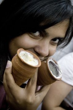 a woman is eating an ice cream cone