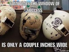 three old helmets with graffiti on them are sitting next to each other, and the caption says sometimes the window of success is only a couple inches wide