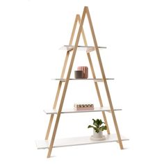 a white shelf with three wooden shelves and a potted plant on the bottom level