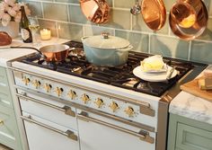 a stove top oven with pots and pans on it