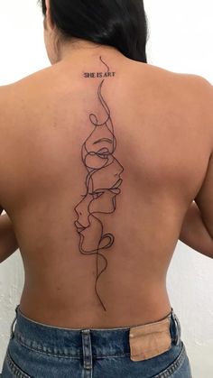 the back of a woman's neck with a line drawing on it