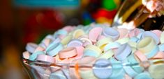 a bowl filled with lots of colorful candy