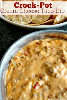 crock pot cream cheese taco dip in a bowl with tortilla chips