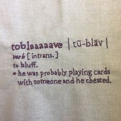 a piece of cloth with writing on it that says, toblaaaave tu - play