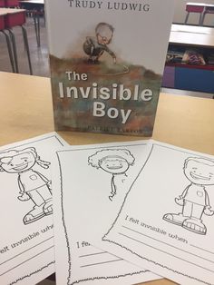 three children's books sitting on top of a table