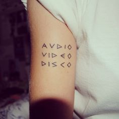 a person with a tattoo on their arm that says avidd video disc disc drive