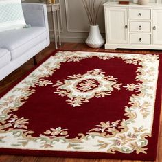 a red and white rug in a living room