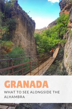 a person walking across a suspension bridge over a river with the words, granada what to see alongside the alhambra