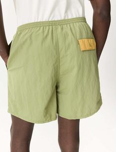 Patagonia baggies shorts (5in) in buckhorn green: these versatile shorts are perfect for land or sea with a mesh liner and quick-drying netplus® material made from recycled fishing nets helping to reduce ocean pollution.    the 5" inseam and fair trade certified™ factory make them both functional and ethical. get ready to take on the great outdoors in style!    product details —    — material: netplus® 100% postconsumer recycled nylon  — durable water repellent (dwr) finish  — recycled polyester Green Shorts With Pockets For Beach Season, Green Shorts With Pockets For Beach, Patagonia Outdoor Shorts With Built-in Liner, Patagonia Outdoor Shorts With Built-in Shorts, Functional Green Nylon Bottoms, Patagonia Outdoor Shorts, Patagonia Shorts For Summer Hiking, Moisture-wicking Green Shorts For Summer, Green Moisture-wicking Beachwear Shorts