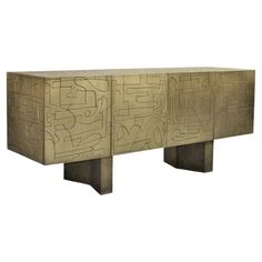 an art deco sideboard made out of metal and wood with graffiti on the sides