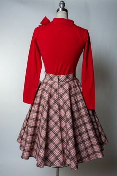 We're Pretty certain every girl adores having a good old circle skirt in her closet. The Haute Circle Skirt is the ultimate classic go-to to match with your favorite blouses and t-shirts. Full Circle Skirt Center Back Zip Yes, Pockets! 2-inch waistband Poly/Rayon/Spandex yarn dyed plaid Made in the USA! Plaid Circle Skirt, Retro Full Skirt In Plaid, Vintage Circle Skirt, 1950s Circle Skirt Pattern, Retro Plaid Knee-length Skirt, Wholesale Gifts, Full Circle, Full Circle Skirts, Student Fashion