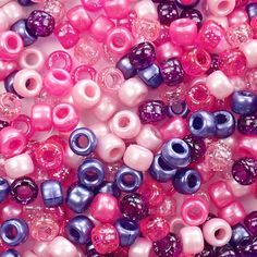 pink, purple and white beads are shown in this close up shot from the top