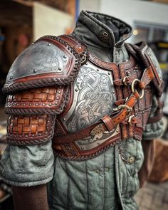 a close up of a person wearing armor