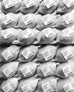 several packages of food are stacked on top of each other in black and white photo