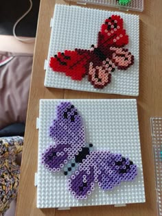 two pieces of lego art made to look like butterflies