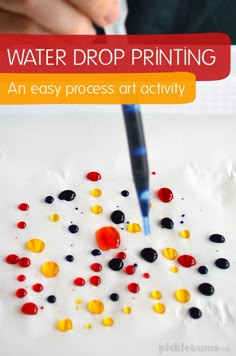 a kid is drawing with water drops on paper and the text overlay reads, water drop printing an easy process art activity