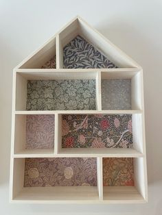 an open shelf with many different designs on it