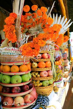 there are many baskets full of fruits and flowers