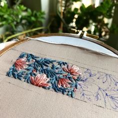 a close up of a embroidery on a table