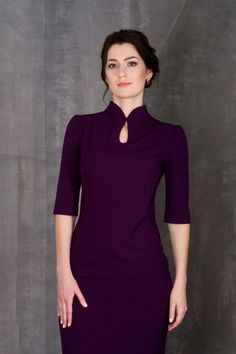 A modern qipao dress featuring a fitted sheath silhouette, midi length and a high neck collar. - modern cheongsam style - keyhole mandarin neck with fabric button - fitted pencil silhouette - knee length (midi) - 2/3 puffy sleeves  - french darts - Concealed back zipper closure Color: Purple / Black / Red / Dark blue Fiber: viscose - 40%, elastane - 5%, polyester - 55% For Size 36 EU / 2 US: dress length - 40"(102 cm), sleeve length - 14,5" (37 cm) Our model wears size 2 US and is 171cm/5'6" tal Elegant Purple Dresses, Mandarin Dress, Mandarin Collar Dress, Black Collared Dress, Modern Qipao, Robes D'occasion, Elegant Cocktail Dress, Structured Dress, Kurta Neck Design