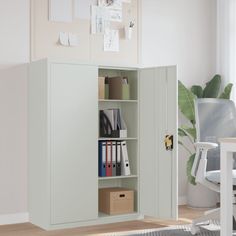 an office with a bookcase, desk and chair next to a plant in the corner