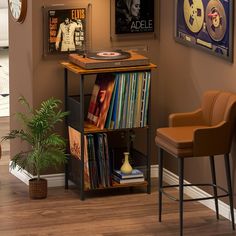 a record player is sitting on top of a shelf in the corner of a room