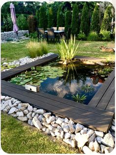 a small pond in the middle of a garden