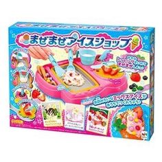 the toy kitchen playset is pink and has lots of food in it's tray