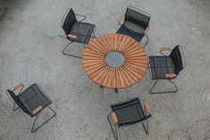 four chairs and a table on the ground