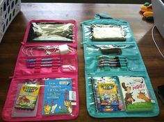 two pink and blue bags filled with children's books on top of a wooden table