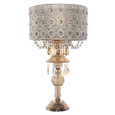 a table lamp with a white shade on it and crystal beads hanging from the bottom