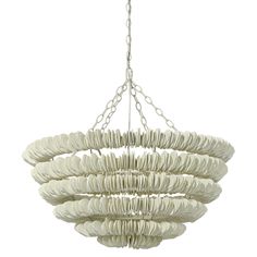 a white chandelier hanging from a chain