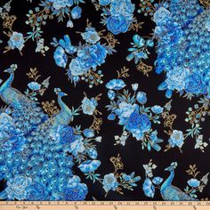 a black background with blue flowers and peacocks