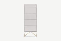 a tall white cabinet with three drawers on one side and two legs on the other