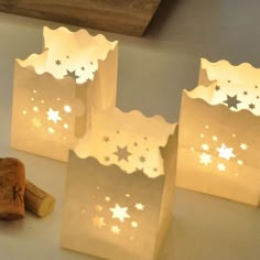 three small paper bags with stars on them