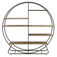 an iron and wood shelf with shelves on it, in the shape of a circle