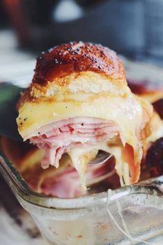 a ham and cheese sandwich in a glass dish