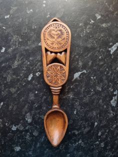 a wooden spoon sitting on top of a black counter