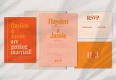 wedding stationery with orange, pink and white colors on the same paper as well as matching envelopes