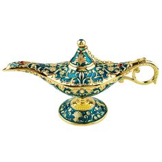 an ornate blue and gold teapot on a white background