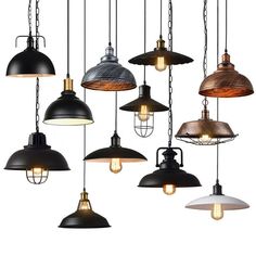 an assortment of industrial style lights hanging from the ceiling