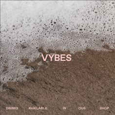 the words vybes are written in pink on top of brown sand and water