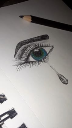 a pencil drawing of an eye with long lashes and blue - green eyeshade